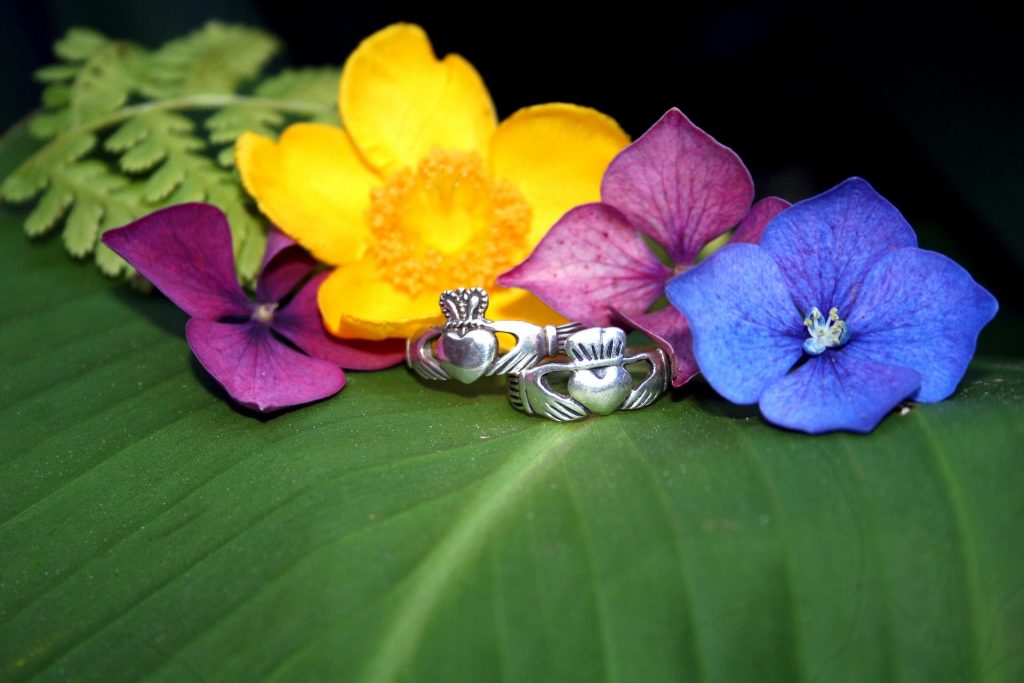 two-claddagh-rings-covered-in-flowers