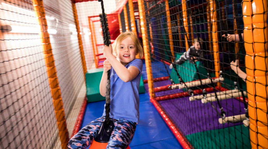 Little girl swinging in Airtastic